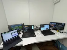 A results room with several laptops running timing and scoring software