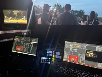 The graphics operator desk with live production screens at night