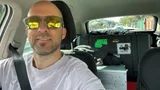 Tobias Däuber on the road, with timing equipment cases packed in the car